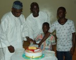 *Lucky Dimeji, his sons and Obasanjo cutting his birthday cake.