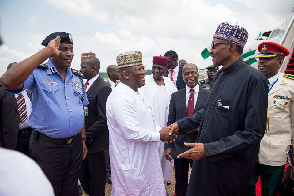 President Buhari acknowledging greetings from dignitaries led by VP Osinbajo who welcomed him from US.