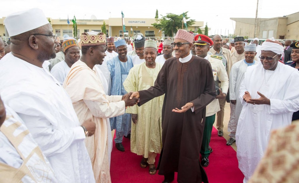 President Buhari in handshake with government officials before his trip to US.