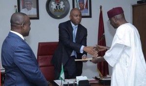 *Senate President, Dr. Bukola Saraki (middle) receiving the ministerial nominees' list from Kyari while Enang watches.