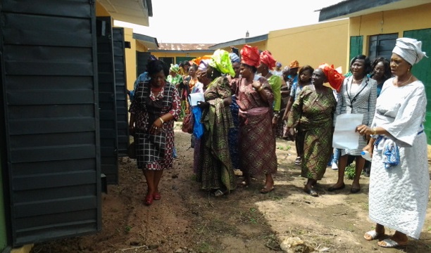 Iyalode Lawson conducting market women round the trade fair complex in Abeokuta.