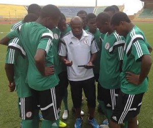 *Coach Amuneke talking to his boys during a training session.