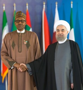 *President Buhari (left) in handshake with Iranian President, Hassan Rouhani on arrival at the forum.