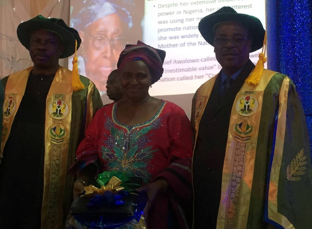 The late HID Awolowo’s daughter with the award conferred on her mother.