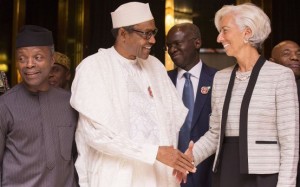 *President Buhari in warm handshake with IMF Christine Largarde in Abuja, Nigeria during her visit.