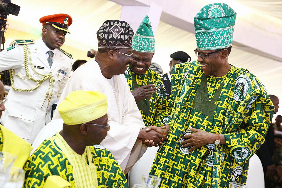 Buhari, Amosun, Ajimobi sharing jokes while Obasanjo watches.