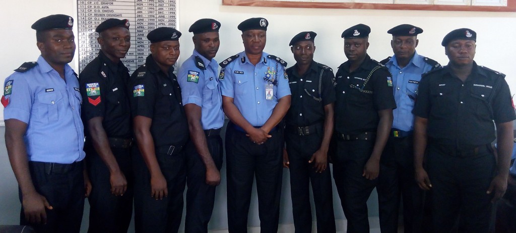 Ali (middle) with the promoted officers.