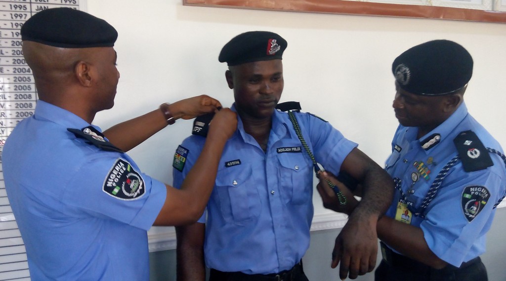 One of the promoted officers being decorated.