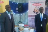 Two lawyers out with books to aid legal practice