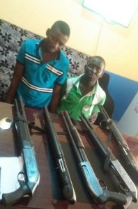 *Awosan and Saka with the seized guns.