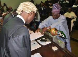 *Amosun tabling the budget proposal for the Speaker.