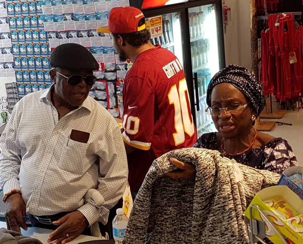 Oba Gbadebo and wife at the store buying clothes for their grandchildren.