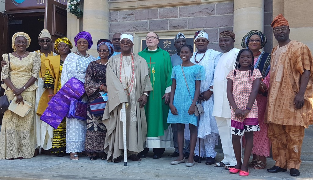 Oba Gbadebo, his wife, the priest and others after the church.