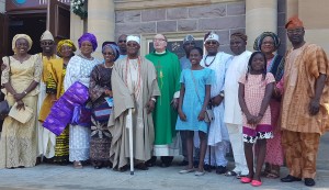 *Oba Gbadebo, his wife, the priest and others after the church.