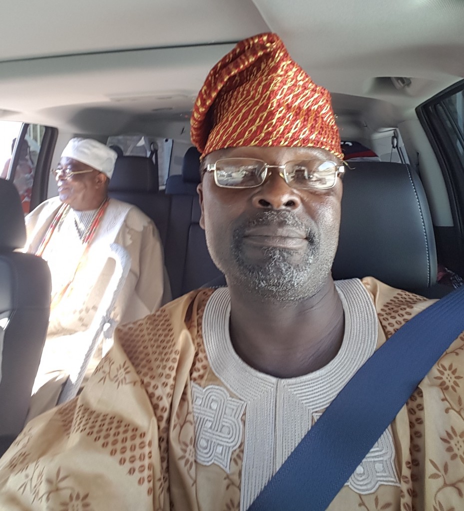 Shodunke at the steering set to drive Oba Gbadebo to church.