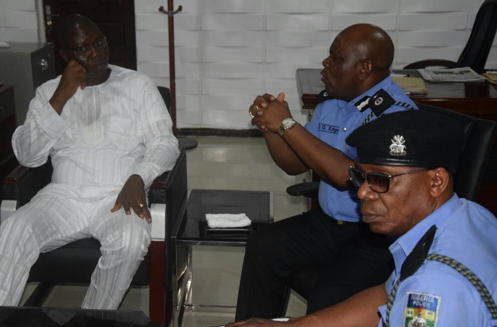 Gani Adams with police officers at the meeting.