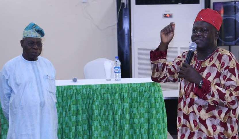 Obasanjo (left) listening as Olori speaks at the retreat.